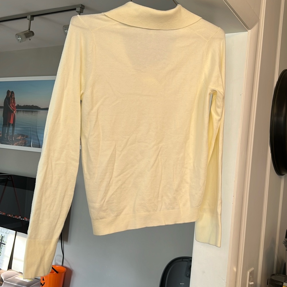 Free assembly blouse, size medium, new with tags, never worn, color is ivory